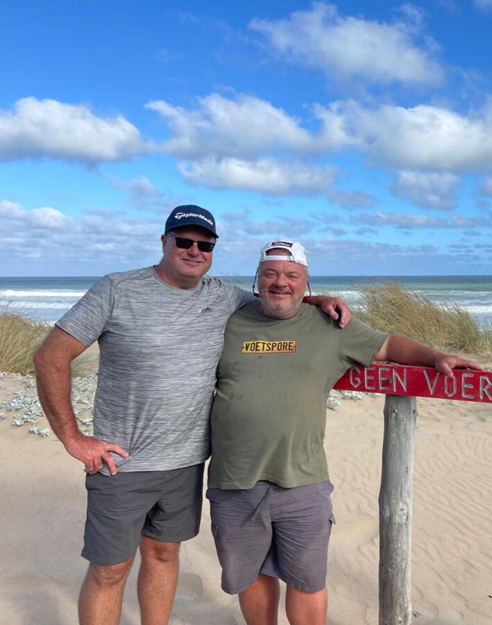 Two golfers reference photo